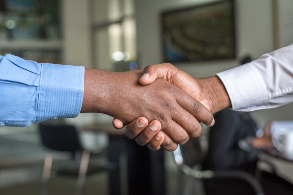 two black men shaking hands